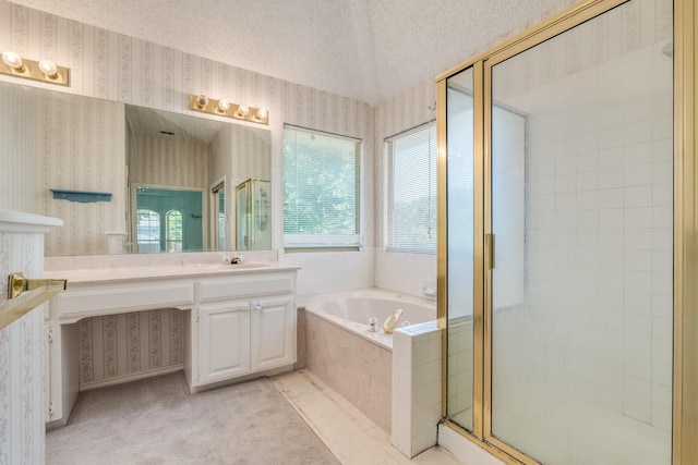 2816 Wateridge Ct, Grapevine, TX 76051 - bathroom featuring wallpapered walls, a stall shower, vanity, a garden tub, and a textured ceiling