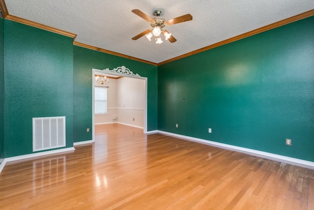 2816 Wateridge Ct, Grapevine, TX 76051 - empty room with a ceiling fan, ornamental molding, a textured ceiling, wood finished floors, and baseboards