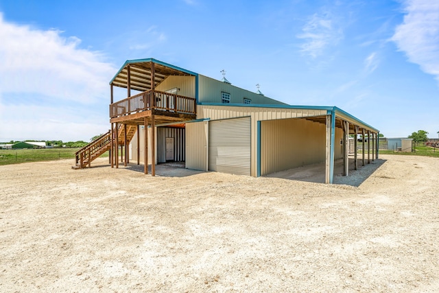 200 County Road 129, Stephenville, TX 76401 - back of house with stairs, a deck, an outbuilding, and dirt driveway