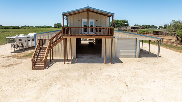 200 County Road 129, Stephenville, TX 76401 - view of front of property featuring stairway, a garage, and an outdoor structure