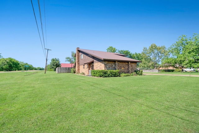 905 W 11th, Clarksville, TX 75426 - view of side of home featuring metal roof