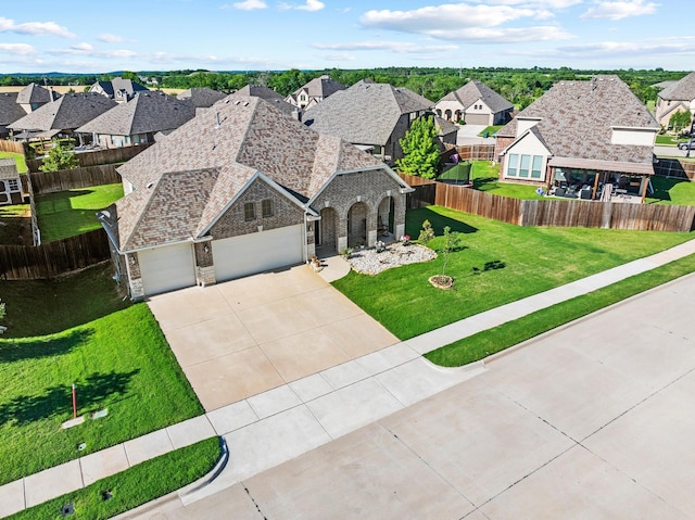 403 Woodbine Dr, Sherman, TX 75092 - view of front of home with stone siding, driveway, a residential view, a garage, and brick siding