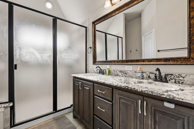 403 Woodbine Dr, Sherman, TX 75092 - bathroom featuring a shower stall, lofted ceiling, and double vanity