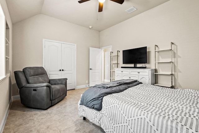 403 Woodbine Dr, Sherman, TX 75092 - bedroom with a closet, baseboards, lofted ceiling, light tile patterned floors, and a ceiling fan