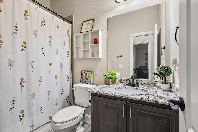 403 Woodbine Dr, Sherman, TX 75092 - bathroom featuring toilet, vanity, a textured wall, and a shower with curtain