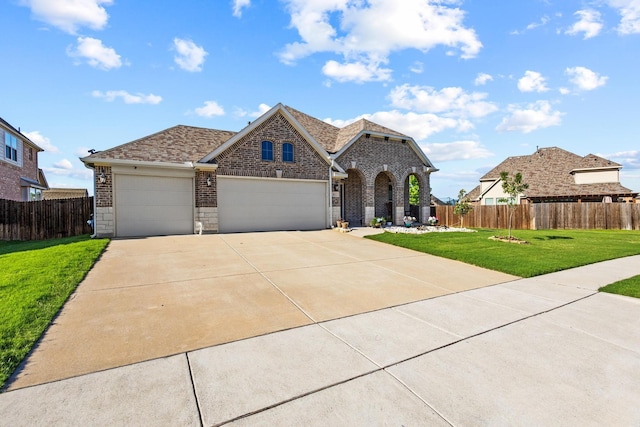403 Woodbine Dr, Sherman, TX 75092 - view of front facade featuring brick siding, an attached garage, concrete driveway, and a shingled roof