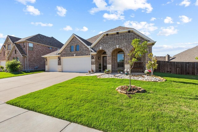 403 Woodbine Dr, Sherman, TX 75092 - view of front of home with brick siding, an attached garage, and driveway