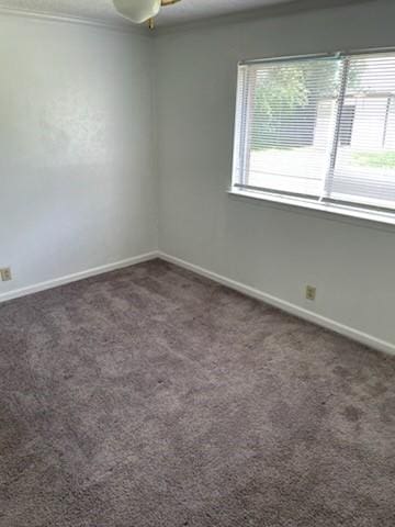 9925 Kittyhawk Ln, Dallas, TX 75217 - unfurnished room with baseboards, carpet floors, and ceiling fan