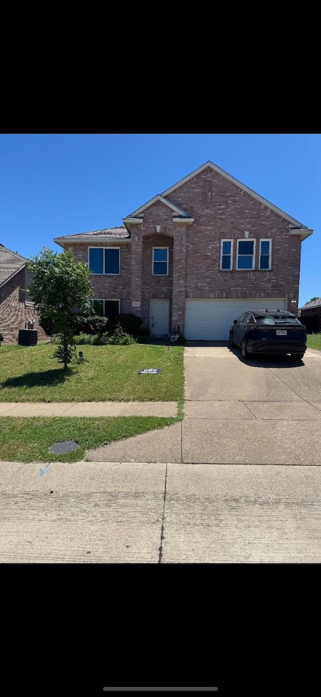 9105 Boone Dr, Mckinney, TX 75071 - view of front of house featuring concrete driveway, a front lawn, and a garage