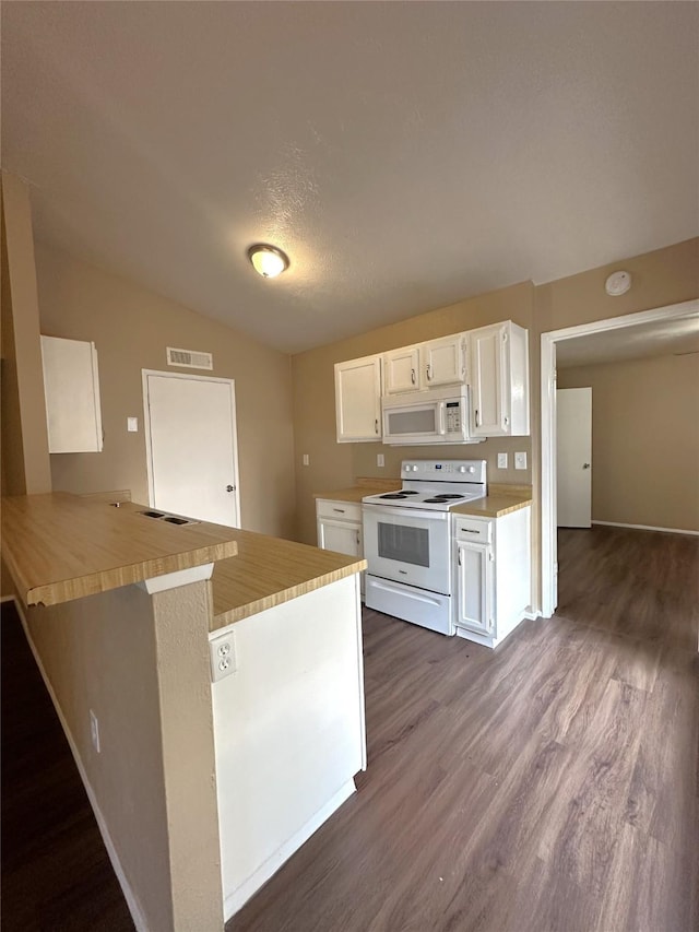 4629 Chapman St, The Colony, TX 75056 - kitchen featuring white appliances, dark wood-style flooring, white cabinetry, light countertops, and a peninsula