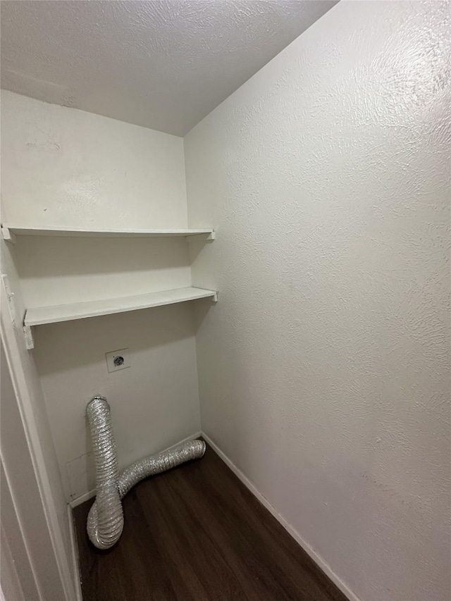 4629 Chapman St, The Colony, TX 75056 - laundry room with electric dryer hookup, dark wood-type flooring, and baseboards