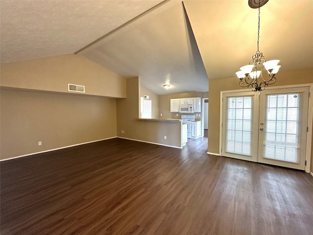 4629 Chapman St, The Colony, TX 75056 - unfurnished living room with dark wood-style floors, a chandelier, baseboards, and plenty of natural light