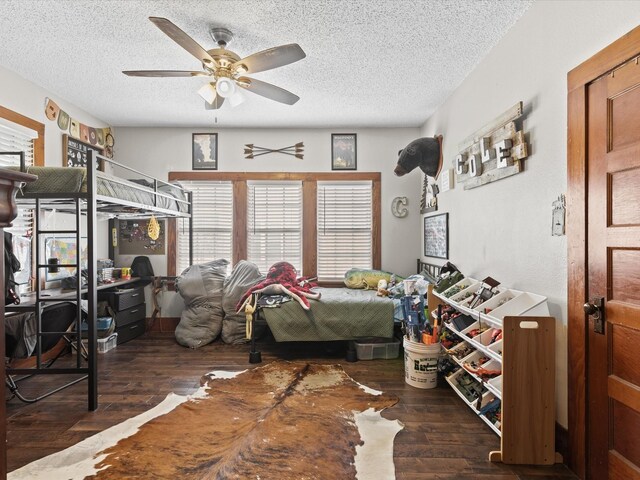 202 S Wood St, Cleburne, TX 76033 - bedroom featuring hardwood / wood-style floors, a textured ceiling, ceiling fan, and an office area