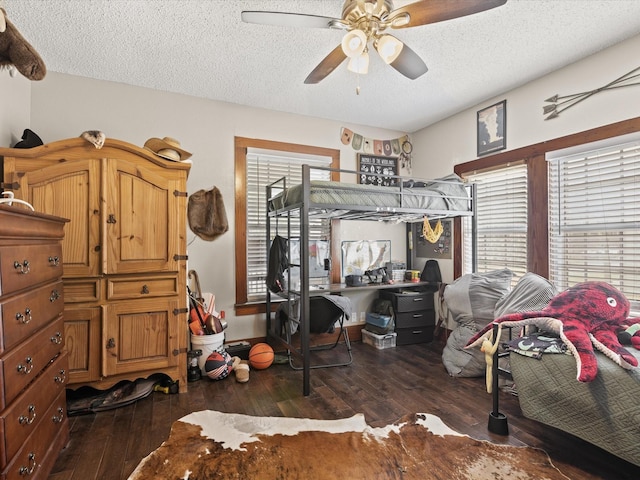 202 S Wood St, Cleburne, TX 76033 - bedroom featuring a textured ceiling, hardwood / wood-style flooring, and ceiling fan