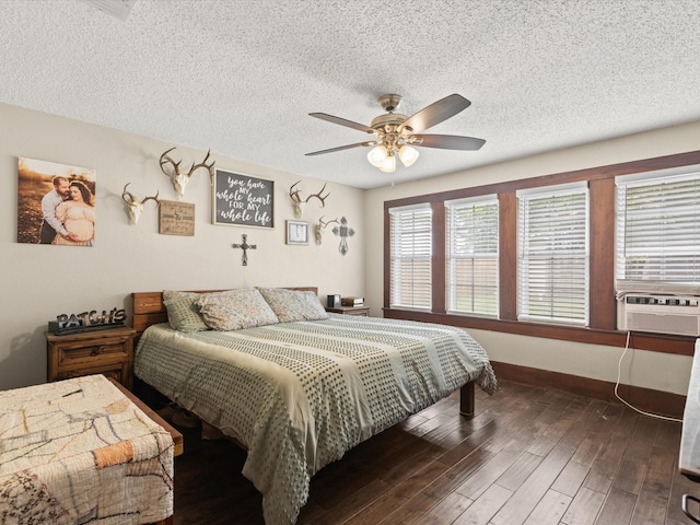202 S Wood St, Cleburne, TX 76033 - bedroom with a textured ceiling, wood finished floors, ceiling fan, baseboards, and cooling unit