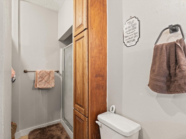 202 S Wood St, Cleburne, TX 76033 - bathroom featuring a shower stall and toilet