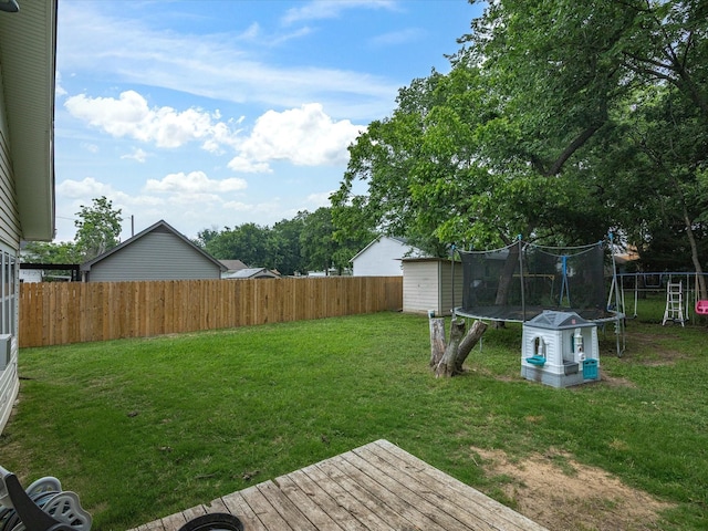 202 S Wood St, Cleburne, TX 76033 - view of yard with a trampoline and a deck