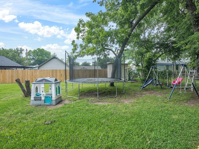 202 S Wood St, Cleburne, TX 76033 - view of yard with a trampoline and a playground