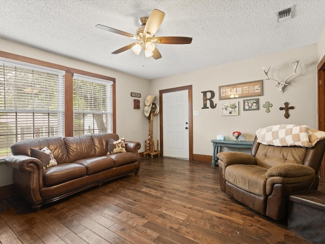 202 S Wood St, Cleburne, TX 76033 - living area with a ceiling fan, a textured ceiling, hardwood / wood-style floors, and baseboards