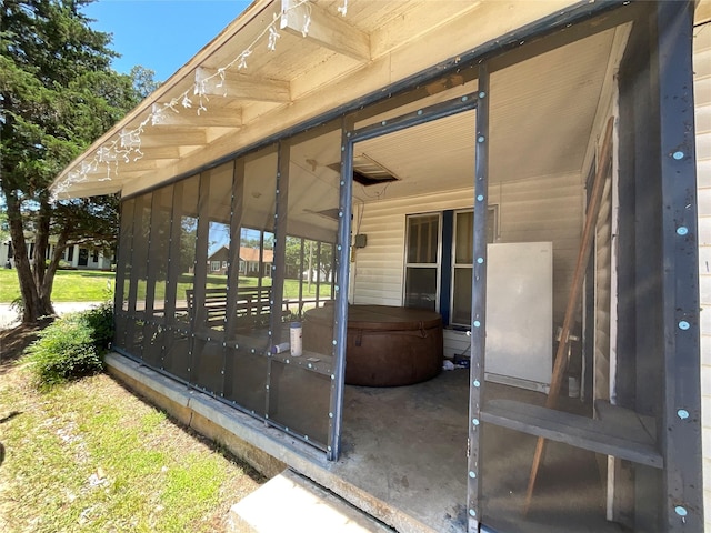1008 Church St, Sulphur Springs, TX 75482 - view of patio with a hot tub and a sunroom