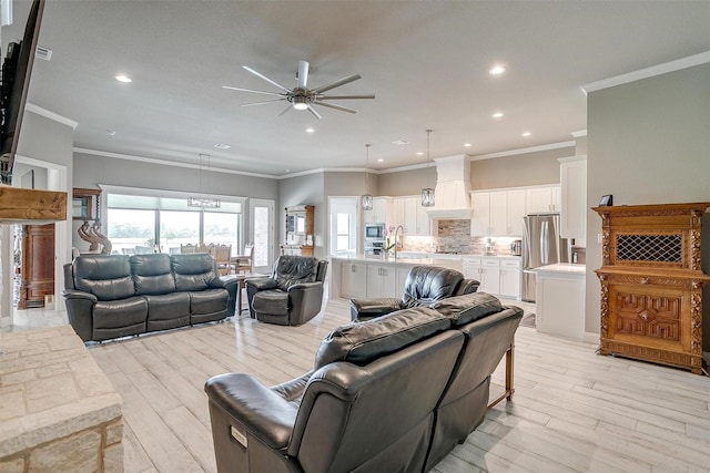 1305 Crown Valley Dr, Weatherford, TX 76087 - living room featuring ceiling fan, light wood-type flooring, recessed lighting, and crown molding