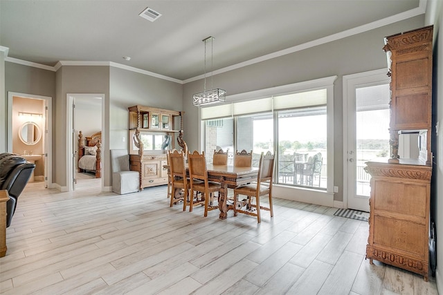 1305 Crown Valley Dr, Weatherford, TX 76087 - dining space featuring light wood-style flooring, crown molding, and baseboards
