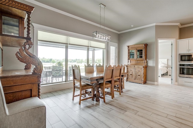 1305 Crown Valley Dr, Weatherford, TX 76087 - dining space featuring crown molding, a chandelier, light wood-type flooring, and baseboards