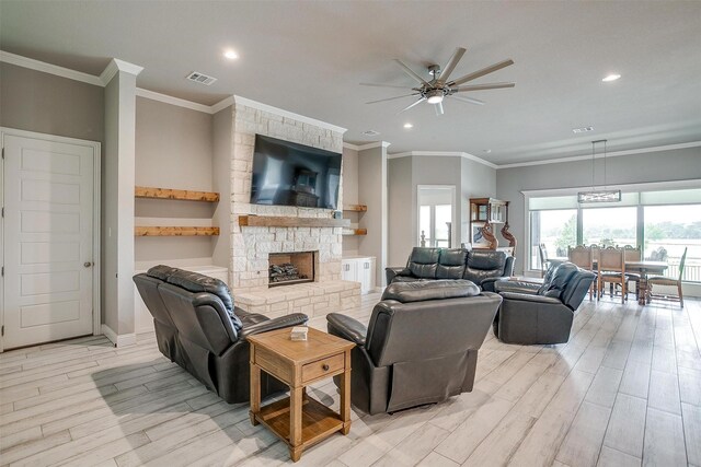 1305 Crown Valley Dr, Weatherford, TX 76087 - living room with a ceiling fan, recessed lighting, light wood finished floors, a fireplace, and ornamental molding