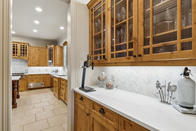 705 Love Henry Ct, Southlake, TX 76092 - kitchen with decorative backsplash, ornamental molding, glass insert cabinets, recessed lighting, and light tile patterned floors