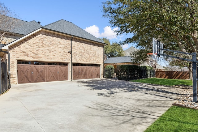 705 Love Henry Ct, Southlake, TX 76092 - view of side of home with driveway, brick siding, a shingled roof, and a garage