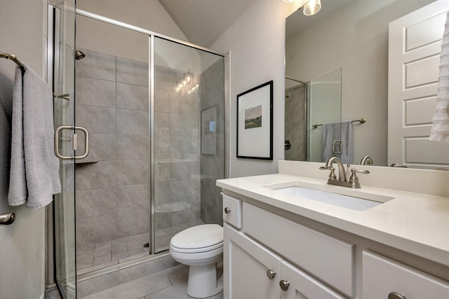 1008 Myers Park Trl, Roanoke, TX 76262 - bathroom featuring toilet, vanity, tile patterned floors, a stall shower, and vaulted ceiling