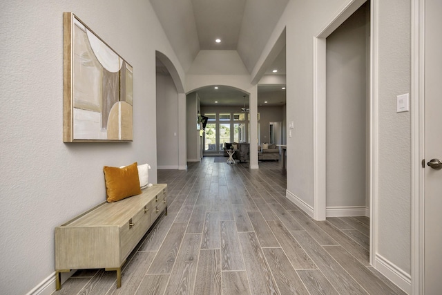 1008 Myers Park Trl, Roanoke, TX 76262 - corridor with arched walkways, wood finished floors, baseboards, lofted ceiling, and recessed lighting