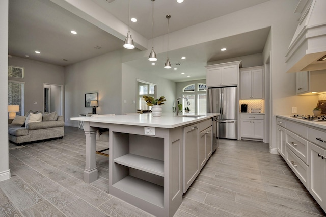 1008 Myers Park Trl, Roanoke, TX 76262 - kitchen featuring custom exhaust hood, stainless steel appliances, a sink, open shelves, and light countertops