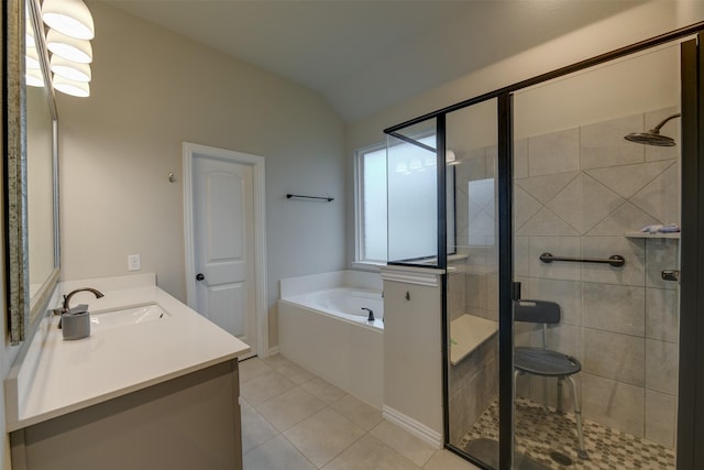 7816 Wheatland Ct, Godley, TX 76044 - bathroom featuring a bath, tile patterned flooring, a shower stall, and vaulted ceiling