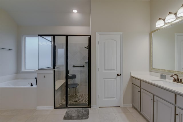 7816 Wheatland Ct, Godley, TX 76044 - bathroom with a shower stall, vanity, a garden tub, and tile patterned flooring