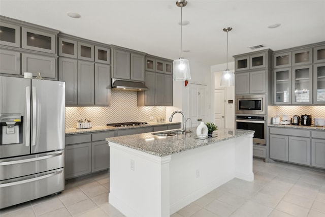 616 Evergreen Rd, Little Elm, TX 76227 - kitchen with stainless steel appliances, gray cabinets, a sink, decorative backsplash, and light tile patterned floors