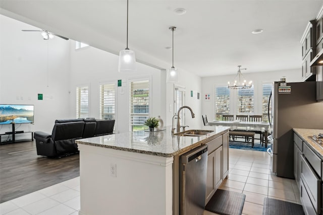 616 Evergreen Rd, Little Elm, TX 76227 - kitchen with a sink, stainless steel appliances, light tile patterned floors, and plenty of natural light