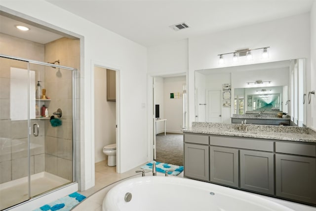 616 Evergreen Rd, Little Elm, TX 76227 - bathroom with a shower stall, toilet, vanity, and a tub to relax in