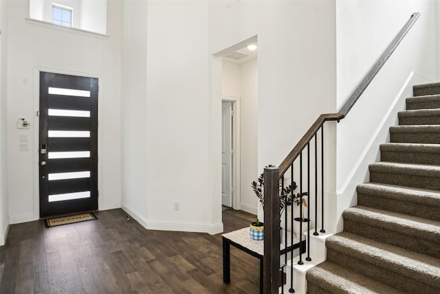 616 Evergreen Rd, Little Elm, TX 76227 - foyer entrance with dark wood-type flooring, stairs, baseboards, and a towering ceiling