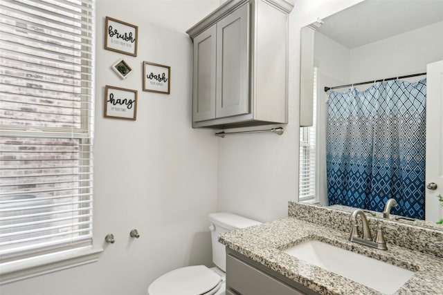 616 Evergreen Rd, Little Elm, TX 76227 - bathroom with plenty of natural light, toilet, vanity, and curtained shower