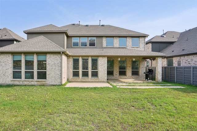 616 Evergreen Rd, Little Elm, TX 76227 - rear view of property featuring a patio, a shingled roof, and brick siding