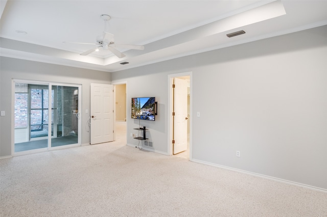 9131 Valley Chapel Ln, Dallas, TX 75220 - spare room with a tray ceiling, baseboards, light carpet, a ceiling fan, and crown molding