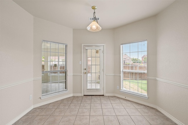 1117 Ruby St, Plano, TX 75094 - doorway featuring light tile patterned floors and baseboards