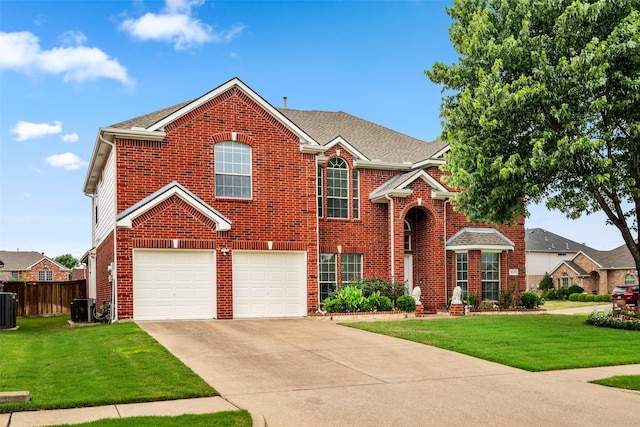 1117 Ruby St, Plano, TX 75094 - traditional home featuring a garage, central AC, driveway, and brick siding