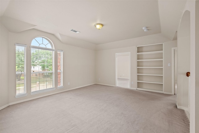 1117 Ruby St, Plano, TX 75094 - unfurnished room with built in shelves, carpet, baseboards, and lofted ceiling