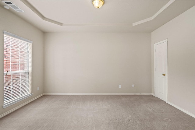 1117 Ruby St, Plano, TX 75094 - unfurnished room with light colored carpet, baseboards, and a raised ceiling