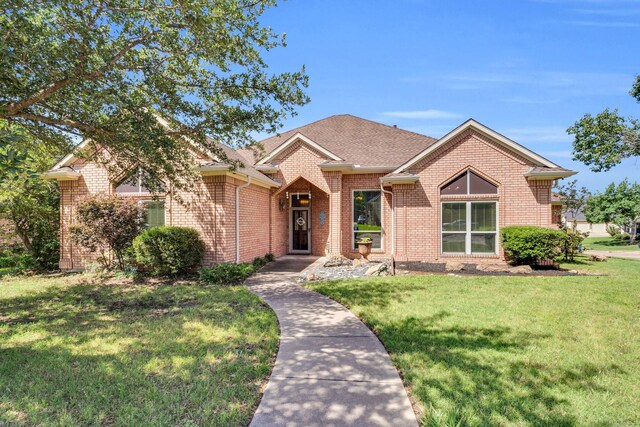 1107 Shoreview Dr, Ennis, TX 75119 - view of front of house featuring brick siding and a front yard
