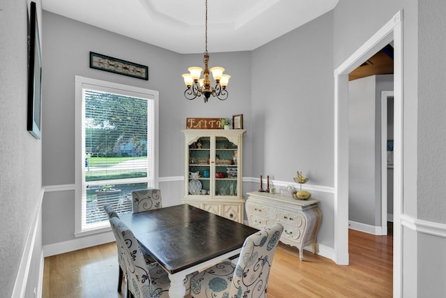 1107 Shoreview Dr, Ennis, TX 75119 - dining room featuring a chandelier and light wood-type flooring