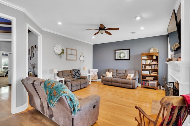 1107 Shoreview Dr, Ennis, TX 75119 - living area with ceiling fan, wood finished floors, recessed lighting, crown molding, and a fireplace