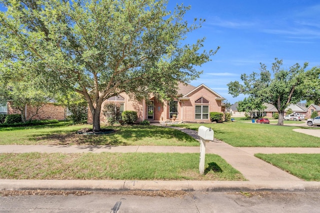 1107 Shoreview Dr, Ennis, TX 75119 - view of front of home featuring a front yard and brick siding